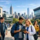 Students collaborating on a modern campus at the New York Institute of Technology, with New York City skyline and technology-focused academic environment in the background.